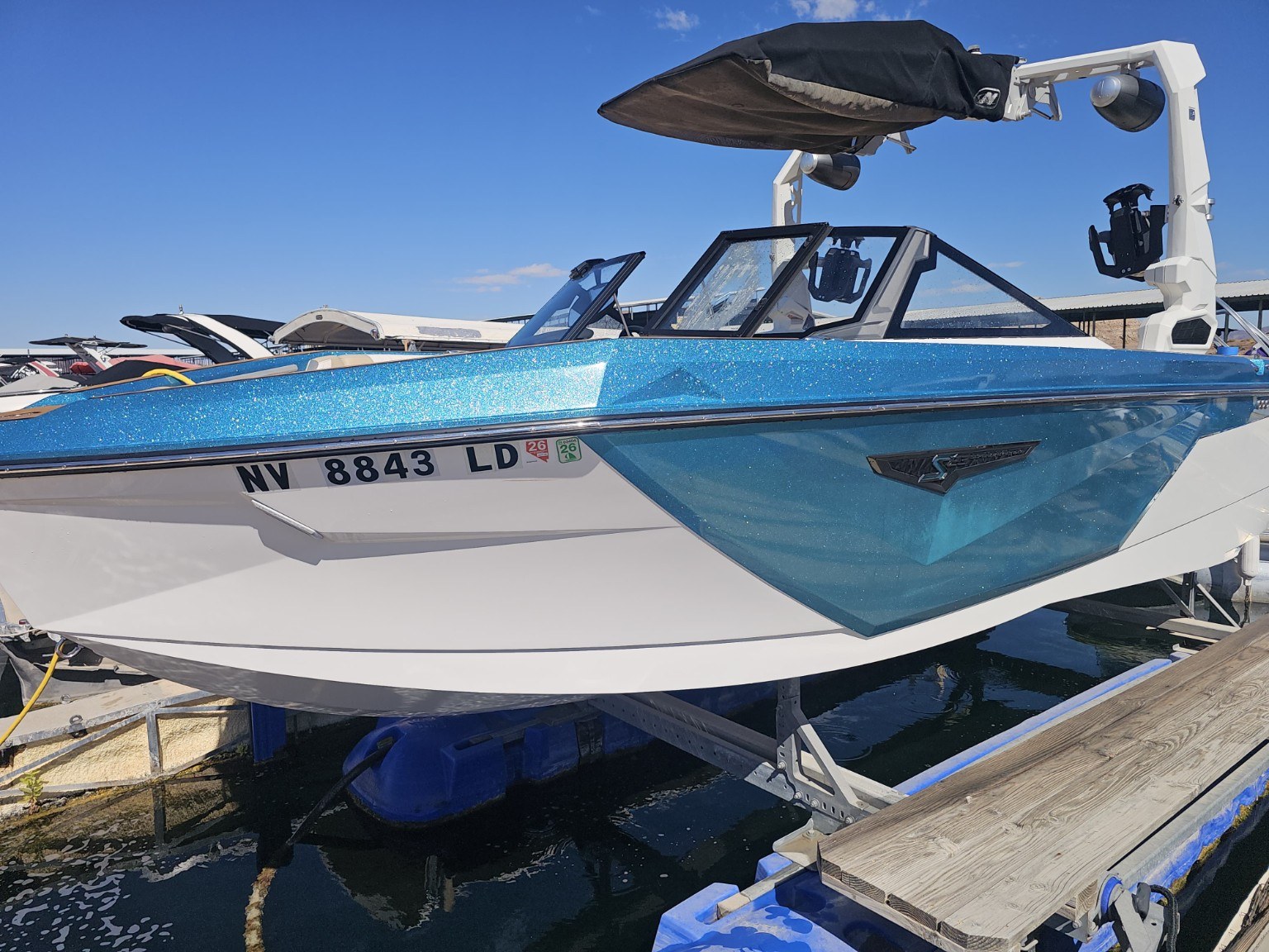 Before detailing: blue and white boat at a Lake Mead marina